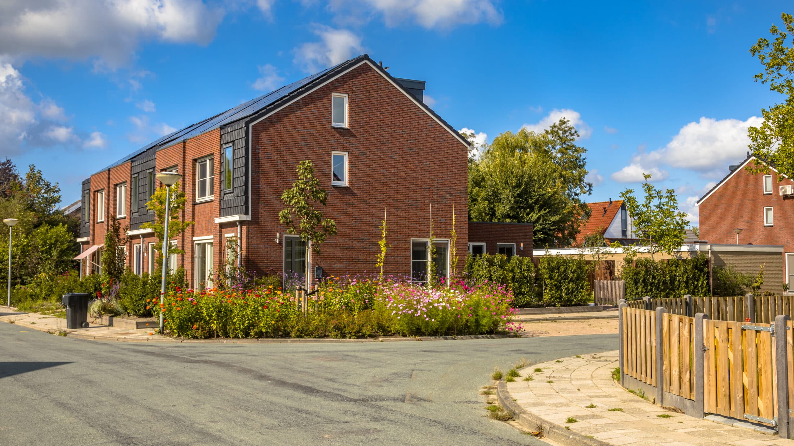 Street landscape with modern houses and flowers in a dutch town, The Netherlands